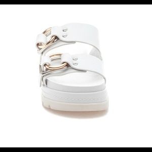 J slides. Sold at high end shops.